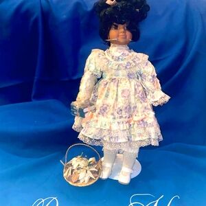 Lovely Porcelain collectible doll named "Vanessa." Print dress & petticoat.